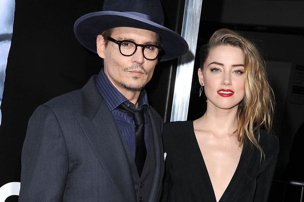 Amber Heard rischia carcere: porta cani in Australia senza autorizzazione
